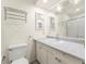 Bathroom featuring a white vanity, large mirror, and chrome fixtures at 9016 W Alabama Pl, Lakewood, CO 80232