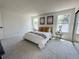 Spacious bedroom with plush carpeting, bright windows, and neutral décor and furnishings at 9016 W Alabama Pl, Lakewood, CO 80232