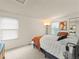 Inviting bedroom with a cozy bed, soft carpet, and natural light for a restful ambiance at 9016 W Alabama Pl, Lakewood, CO 80232