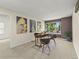 Bright home office featuring modern art, a stylish desk, comfortable chairs, and plenty of natural light at 9016 W Alabama Pl, Lakewood, CO 80232