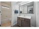 Bright bathroom featuring a vanity with cabinet storage and a bathtub at 2003 S Helena St # D, Aurora, CO 80013