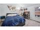 Bright bedroom with a large bed, desk area, stylish decor, and natural light at 2003 S Helena St # D, Aurora, CO 80013