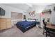 Bright bedroom boasts vaulted ceilings, carpet floors, and a unique world map wall decoration at 2003 S Helena St # D, Aurora, CO 80013