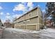 Exterior view of multi-Gathering residences with attached garages and well-maintained landscaping at 2003 S Helena St # D, Aurora, CO 80013