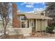 Charming two-story home with manicured front lawn, mature trees, brick chimney and inviting entrance at 2003 S Helena St # D, Aurora, CO 80013