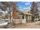Charming two-story home with manicured front lawn, mature trees, brick chimney and inviting entrance at 2003 S Helena St # D, Aurora, CO 80013
