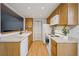 Functional kitchen offers ample cabinet space and modern white appliances for easy living at 2003 S Helena St # D, Aurora, CO 80013