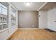 Bright living room with large windows, a neutral color scheme, and wood-look flooring at 2003 S Helena St # D, Aurora, CO 80013