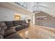 Open-concept living area boasts wood floors, a staircase, and view into the kitchen at 2003 S Helena St # D, Aurora, CO 80013