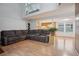 Bright, open-concept living room with hardwood floors and natural light and view to kitchen at 2003 S Helena St # D, Aurora, CO 80013