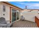 Private outdoor balcony featuring wood decking and peaceful neighborhood views at 1236 Sequerra St, Broomfield, CO 80020