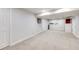 Spacious finished basement featuring neutral carpet and white walls, perfect for versatile living space at 1236 Sequerra St, Broomfield, CO 80020