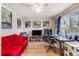 Bright bedroom with natural light, laminate flooring, and a comfortable workspace and a red sofa at 1236 Sequerra St, Broomfield, CO 80020