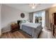 Cozy bedroom featuring a ceiling fan, sliding glass doors to a private balcony, and comfortable furnishings at 1236 Sequerra St, Broomfield, CO 80020