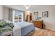 Comfortable bedroom featuring a ceiling fan and sliding glass doors to a private outdoor balcony at 1236 Sequerra St, Broomfield, CO 80020