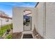 Courtyard gate at front of home with beautiful desert-style landscaping at 1236 Sequerra St, Broomfield, CO 80020
