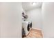 Convenient laundry room featuring a modern washer and dryer with shelving for storage at 1236 Sequerra St, Broomfield, CO 80020