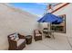 Cozy patio featuring wicker furniture with an umbrella and string lights for outdoor relaxation at 1236 Sequerra St, Broomfield, CO 80020