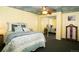 Comfortable bedroom featuring a ceiling fan, cloud-painted ceiling, and a mirrored closet for ample storage at 7684 Beverly Blvd, Castle Pines, CO 80108