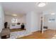 Cozy bedroom with hardwood floors, plush bedding, and ample natural light from multiple windows at 7684 Beverly Blvd, Castle Pines, CO 80108