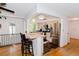 Bright kitchen with stainless steel appliances and bar seating, perfect for casual dining and entertaining at 7684 Beverly Blvd, Castle Pines, CO 80108