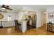 Bright kitchen featuring stainless steel appliances and a breakfast bar perfect for casual dining at 7684 Beverly Blvd, Castle Pines, CO 80108