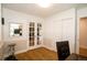 Office space features white wainscotting, hardwood floors, french doors, and a mirrored accent at 7684 Beverly Blvd, Castle Pines, CO 80108