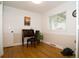 Bright office space with hardwood floors and a vintage desk, ideal for a home workplace at 7684 Beverly Blvd, Castle Pines, CO 80108