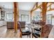 Dining area with adjacent kitchen featuring natural wood beams, views of dining area and kitchen at 8191 S Homesteader Dr, Morrison, CO 80465