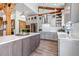 Spacious kitchen with stainless steel appliances, natural wood accents, and a large center island at 8191 S Homesteader Dr, Morrison, CO 80465