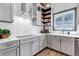 Modern kitchen with white countertops and subway tile offers a clean and bright cooking space at 8191 S Homesteader Dr, Morrison, CO 80465