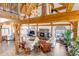 Spacious living room with fireplace, high ceilings, and wood beam accents at 8191 S Homesteader Dr, Morrison, CO 80465