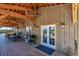 Outdoor covered patio with dining and grilling area, and outdoor seating for relaxing and entertaining at 8191 S Homesteader Dr, Morrison, CO 80465