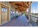 Covered porch with outdoor seating and wooden beams offers a relaxing outdoor space to enjoy the scenery at 8191 S Homesteader Dr, Morrison, CO 80465