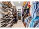 Organized walk-in closet with shoe shelves, hanging rods, and ample space for clothing and accessories at 8191 S Homesteader Dr, Morrison, CO 80465