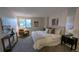 Neutral bedroom featuring plush carpet, modern lamps, accent furniture, and a comfortable, well-lit space at 12506 E Cornell Ave # 201, Aurora, CO 80014