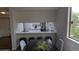 Dining room area and breakfast bar area with a large picture window looking to the outside at 12506 E Cornell Ave # 201, Aurora, CO 80014