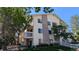 Multi-level condo building with brick accents, balconies, and well-maintained landscaping at 12506 E Cornell Ave # 201, Aurora, CO 80014