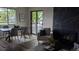 An open floor plan that leads to a dining room area, fireplace with a large sliding door to the exterior at 12506 E Cornell Ave # 201, Aurora, CO 80014