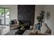 Living room featuring a dark marble fireplace and neutral-toned seating area at 12506 E Cornell Ave # 201, Aurora, CO 80014