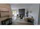 Cozy living room with modern fireplace, stylish furniture, and ample natural light at 12506 E Cornell Ave # 201, Aurora, CO 80014