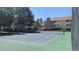 Outdoor tennis court with apartment buildings in the background at 12506 E Cornell Ave # 201, Aurora, CO 80014