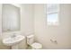 Clean powder room with pedestal sink and window to provide natural light at 13432 E 110Th Way, Commerce City, CO 80022