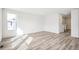 Well-lit, spacious living room with hardwood floors and neutral paint, perfect for customization at 13432 E 110Th Way, Commerce City, CO 80022
