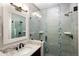 Modern bathroom featuring a glass-enclosed shower, granite countertop, and brushed nickel fixtures at 9591 Sunset Hill Dr, Lone Tree, CO 80124