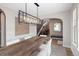 Dining room features a large wood table, modern lighting, and elegant decor; perfect for entertaining guests at 9591 Sunset Hill Dr, Lone Tree, CO 80124