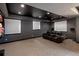 Well-lit home theater with comfortable seating and an integrated surround sound system at 9591 Sunset Hill Dr, Lone Tree, CO 80124