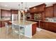 Beautiful kitchen with granite island, stainless steel appliances, and ample custom cabinetry at 9591 Sunset Hill Dr, Lone Tree, CO 80124