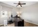 Functional office space with desk, ceiling fan, natural light and sleek hardwood flooring at 9591 Sunset Hill Dr, Lone Tree, CO 80124