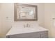 Bathroom vanity with a square sink, large mirror reflecting the shower, providing a modern and functional space at 7777 Newman St, Arvada, CO 80005